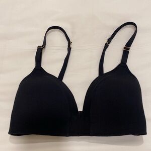 Lively black 34 D bra, with gold hardware. Net mesh embellished